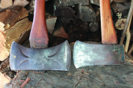 The heads of two axes, one double-sided and one single-sided