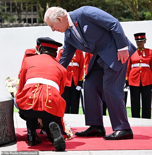 The King lays his wreath before going to view Kenya's celebrated Mugomo Tree
