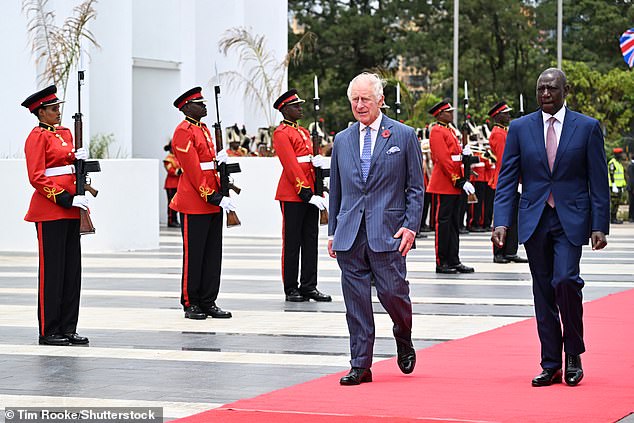 King Charles and President William Ruto at the official reception, flanked by guards