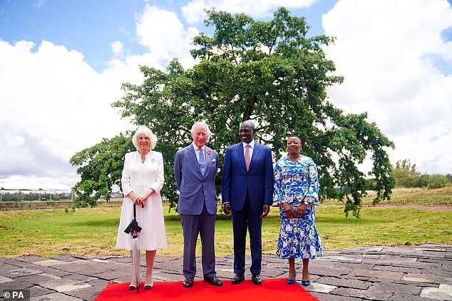 Queen Camilla, King Charles III, President of Kenya, Dr William Ruto, and First Lady of Kenya Rachel Ruto pose for a photograph in front of the Mugomo Tree