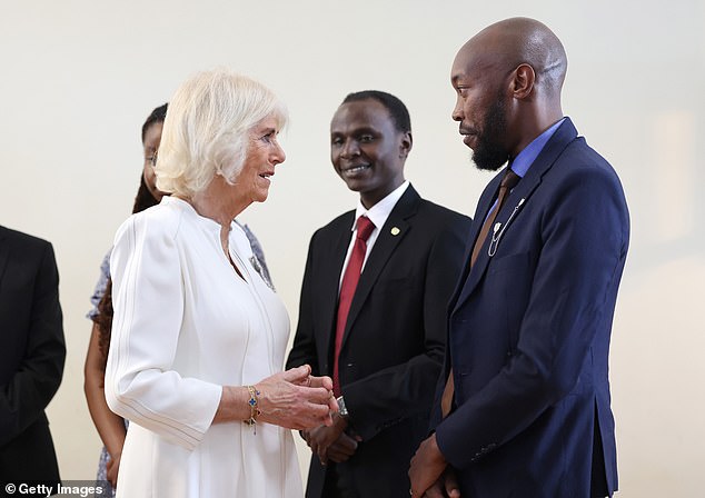 Queen Camilla speaks with founders of Book Bunk, a charity that restores public libraries
