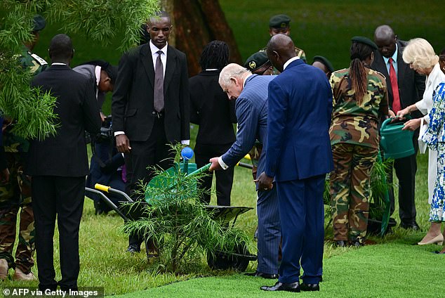 Charles plants a tree while standing next to President Ruto at State House in Nairobi today