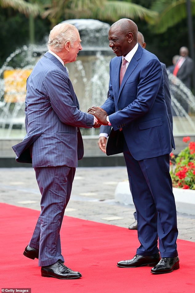 King Charles III shakes hands with Kenya's President William Ruto in Nairobi today