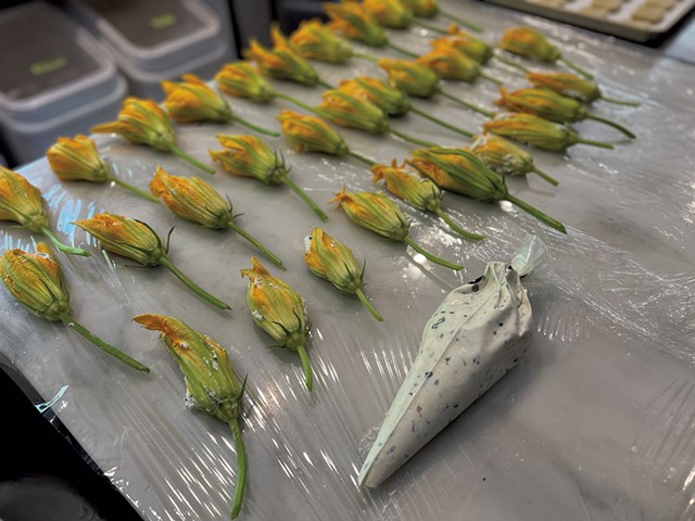 Red Barn Kitchen squash blossoms filled with herbed, housemade goat milk ricotta in 2022 - COURTESY