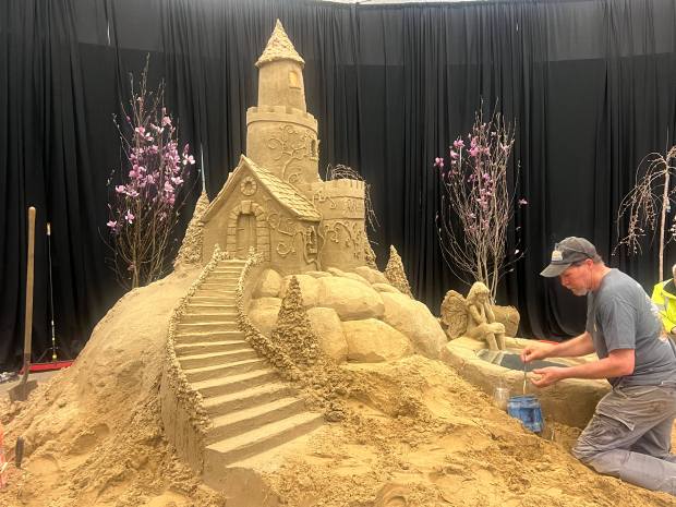 Phil Singer, Capital Region sand artist, building a castle Friday. (Erica Bouska - MediaNews Group)